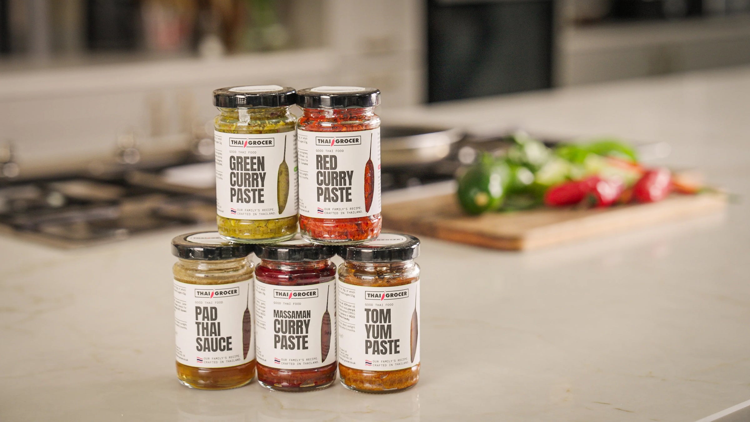 Thai Grocer small-batch curry paste jars in a bright kitchen